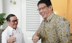 Pejabat-DKI-Jakarta-Dana-Mengendap-14-Triliun-Anggaran-Daerah.webp Dua tokoh penting Pemprov DKI Jakarta tersenyum lebar dan mengacungkan jempol (thumbs up), mengisyaratkan optimisme.
