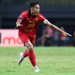 rizky-ridho-nominasi-puskas-award-2025.jpeg Rizky Ridho, pemain sepak bola Indonesia, berlari merayakan gol dengan ekspresi gembira saat pertandingan malam hari.