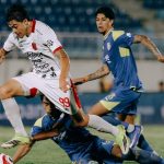 hasil-super-league-bali-united-vs-arema-fc.jpg Selebrasi emosional pemain Bali United setelah mencetak gol kemenangan melawan Arema FC di Stadion Kanjuruhan.