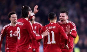 Selebrasi Andrew Robertson, Mohamed Salah, dan Virgil van Dijk setelah mencetak gol untuk Liverpool melawan Wolves di Piala FA.