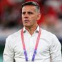 Potret John Herdman mengenakan kemeja putih dengan ID lanyard FIFA World Cup.
