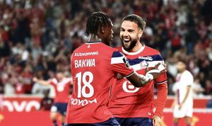 calvin-verdonk-skuad-lille-liga-champions.webp Calvin Verdonk tersenyum dan merayakan momen bersama rekan setimnya di Lille.