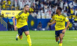 cristiano-ronaldo-al-nassr-al-kholood-5.webp Cristiano Ronaldo melakukan selebrasi usai mencetak gol untuk Al Nassr melawan Al Kholood.